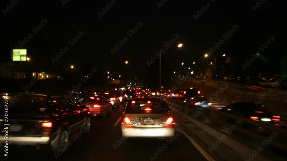 High-speed driver's POV of traffic approaching a toll gate in NYC at night High-speed driver's POV of traffic approaching a toll gate in NYC at night