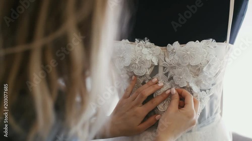 Fashion Designer for Brides in Her Studio Pins Needles Lace and Flowers Wdding Dress. photo