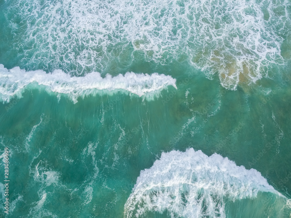 Fototapeta premium Large waves crushing - aerial view