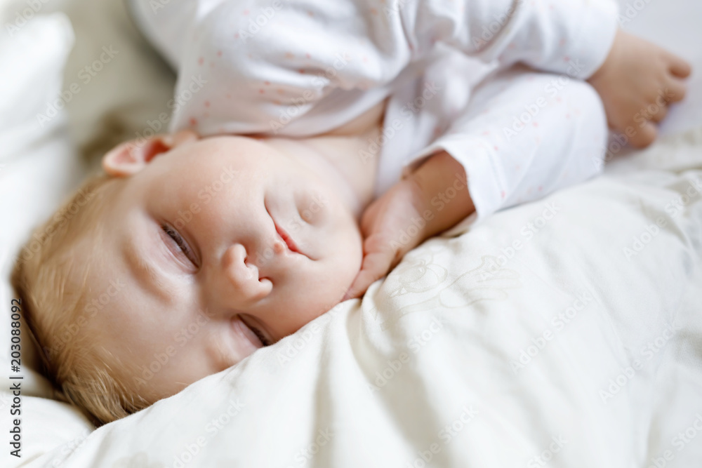 Cute adorable baby girl of 6 months sleeping peaceful in bed Cute adorable baby girl of 6 months sleeping peaceful in bed