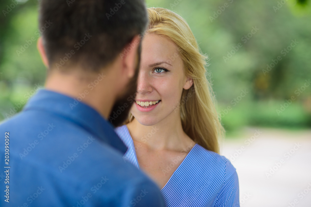 First meet of strangers, girl looks at bearded man First meet of strangers, girl looks at bearded man