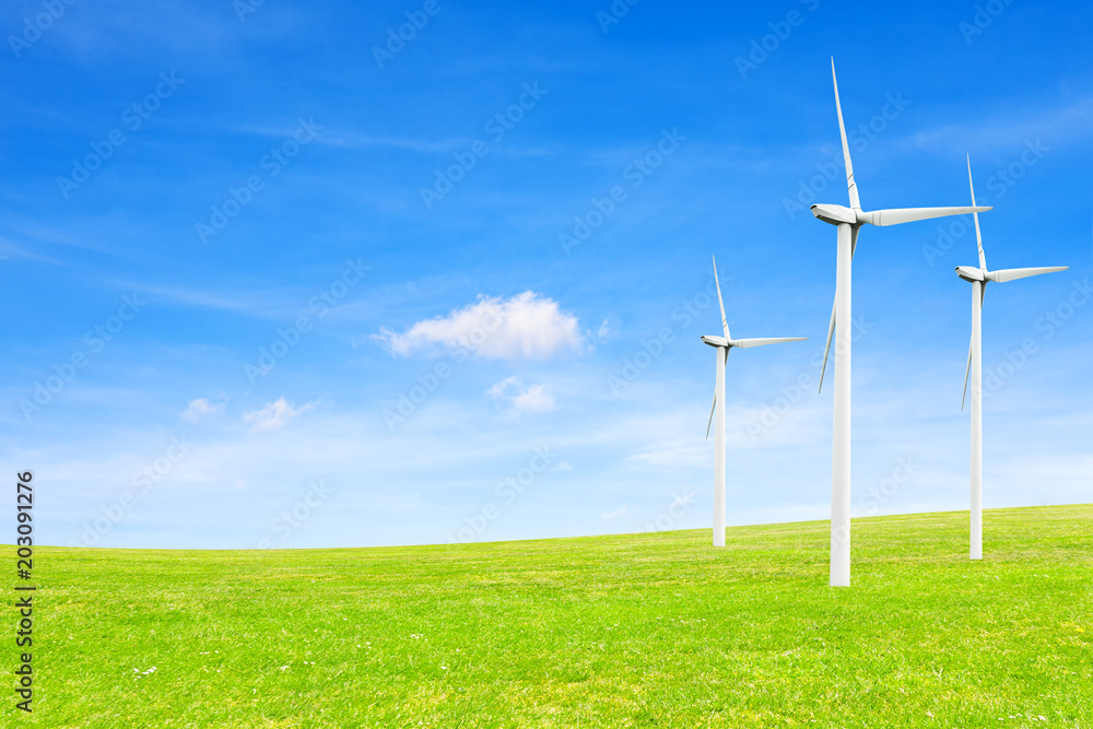 Ecology concept. windmills, field and beautiful sky. Renewable energy sources Ecology concept. windmills, field and beautiful sky. Renewable energy sources