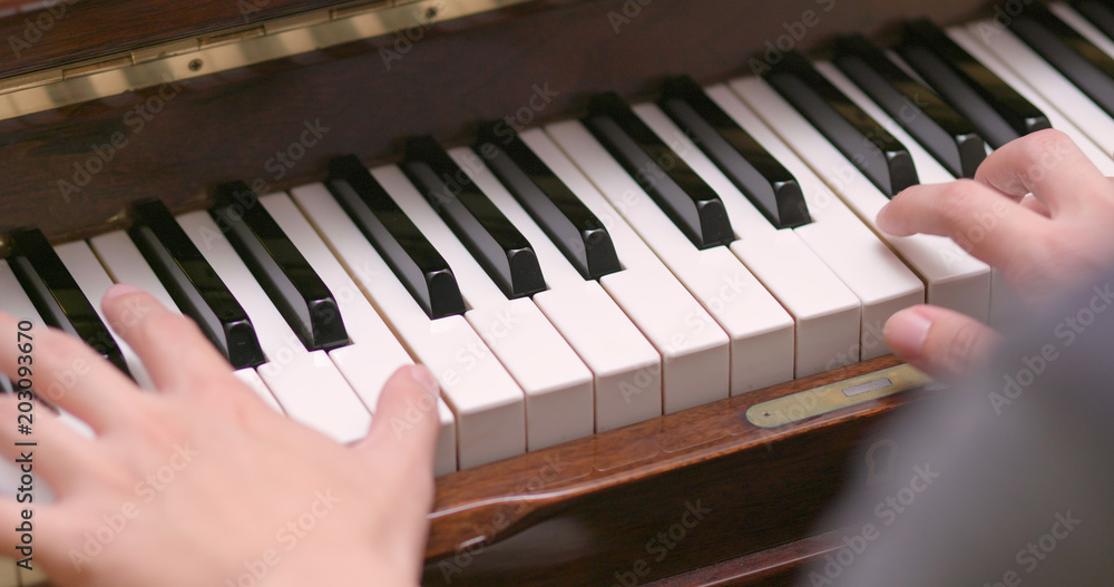 Fototapeta premium Man practicing piano