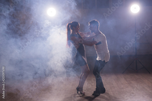 Fototapeta Naklejka Na Ścianę i Meble -  Active happy adults dancing bachata together in dance class