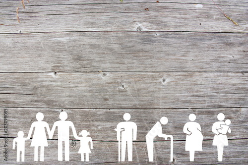 Family and Weak social categories welfare concept on wooden background