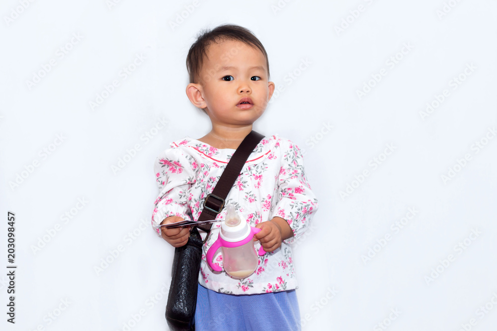Nice little girl with bag holding credit card for shopping on white background Nice little girl with bag holding credit card for shopping on white background