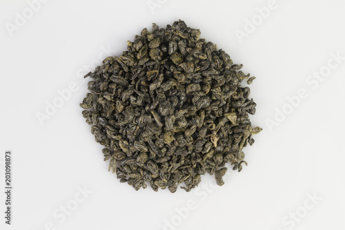Fotografía Heap of green gunpowder tea pellets on white background
