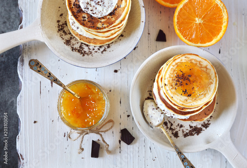 Ricotta pancakes with orange jam and chocolate, two servings