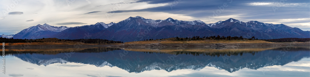 Mountain range reflecting in Lake Argentina