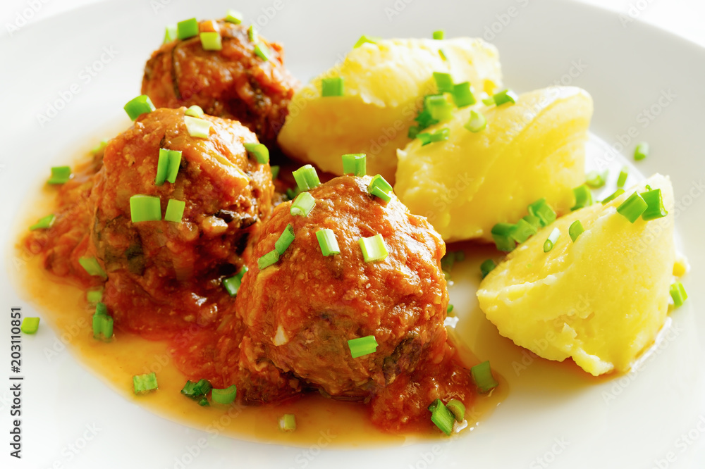 beef meatballs cooked with rice stewed in tomato sauce garnished with potato beef meatballs cooked with rice stewed in tomato sauce garnished with potato