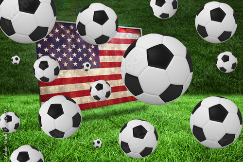 Black and white footballs against usa flag in grunge effect