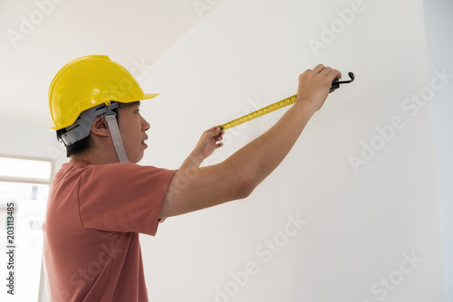 Interior engineer measure new house wall
