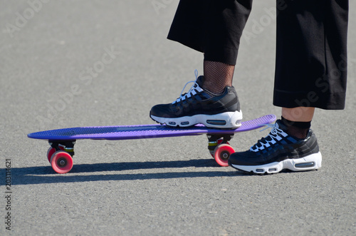 Skateboarding on the asphalt track.