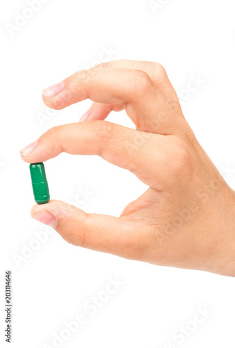 Green capsule in hand