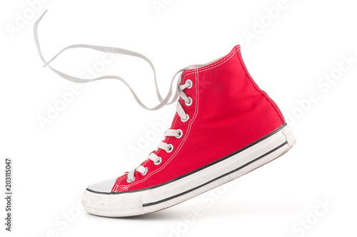 Fényképezés Single red sneaker on white background