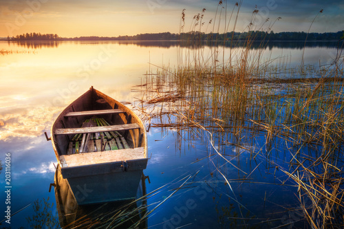 Fototapeta Naklejka Na Ścianę i Meble -  Rowing boat floating over the Lake Selment Wielki waters. Masuria, Poland.