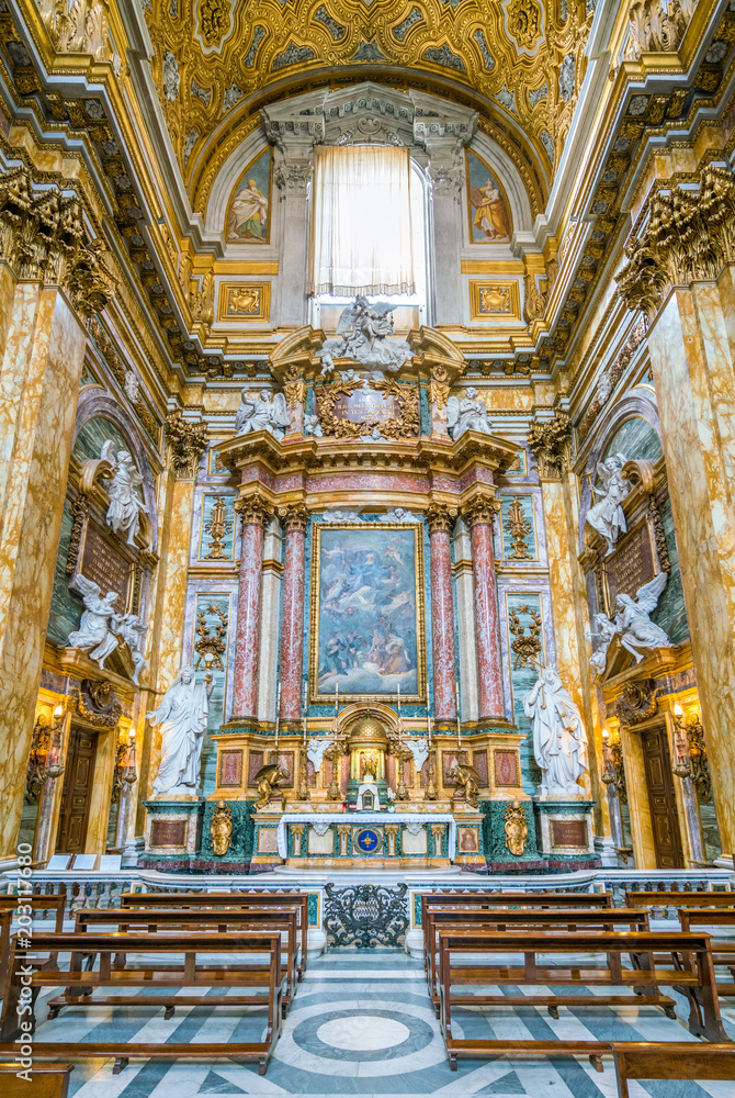 Altar in the transept of the Basilica of the Santi Ambrogio e Carlo al Corso, in Rome, Italy.