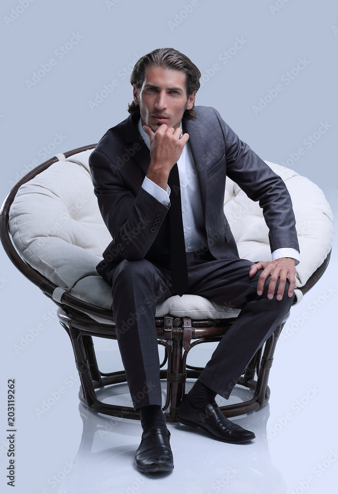 confident businessman sitting in chair confident businessman sitting in chair