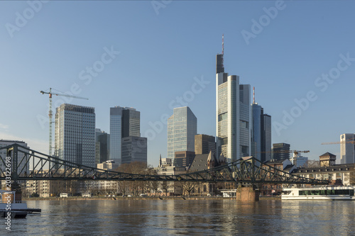 panoramic view of skyline of Frankfurt with old iron foot bridge © travelview