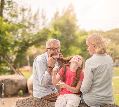 happy family playing in garden park © saksit