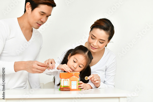 Parents are teaching children to save money. © S photographer