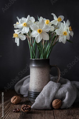 A bouquet of daffodils on a wooden background