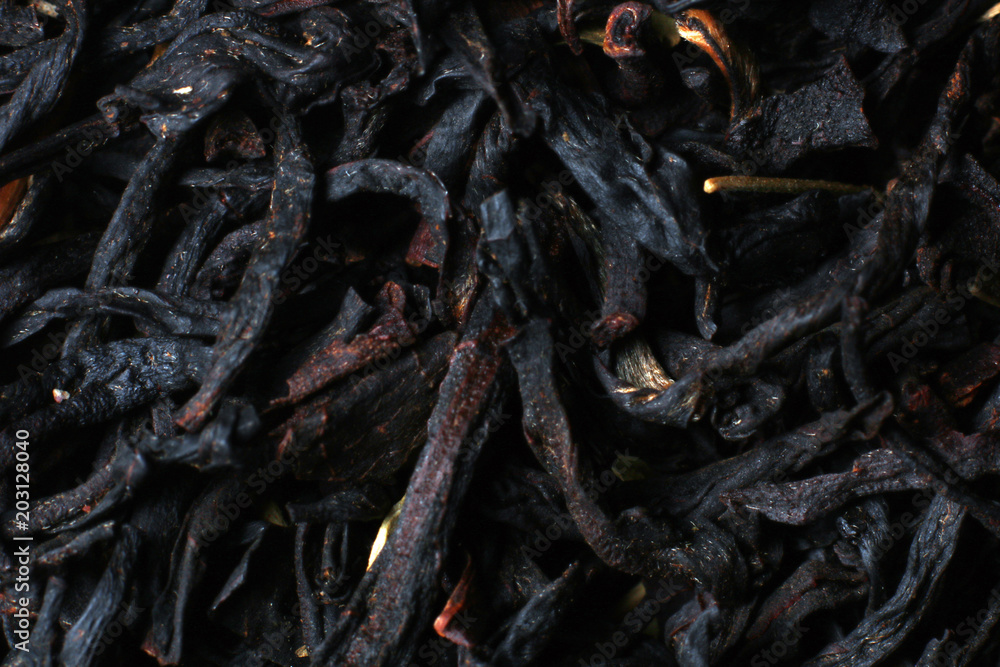 Black tea texture. Dry black sheet tea.
