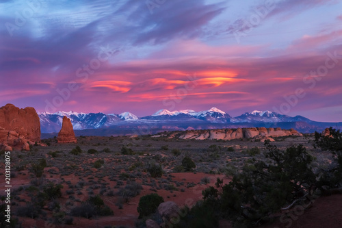 Magnificent Sunset on the La Sal Mountains with Spiral CLoud Formations in Arches National Park, Utah