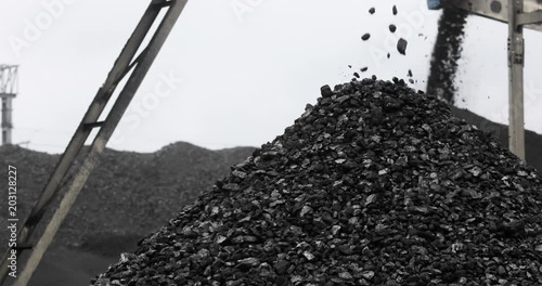mountain of coal, coal falls from the conveyor