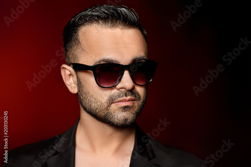 man in sunglasses and suit