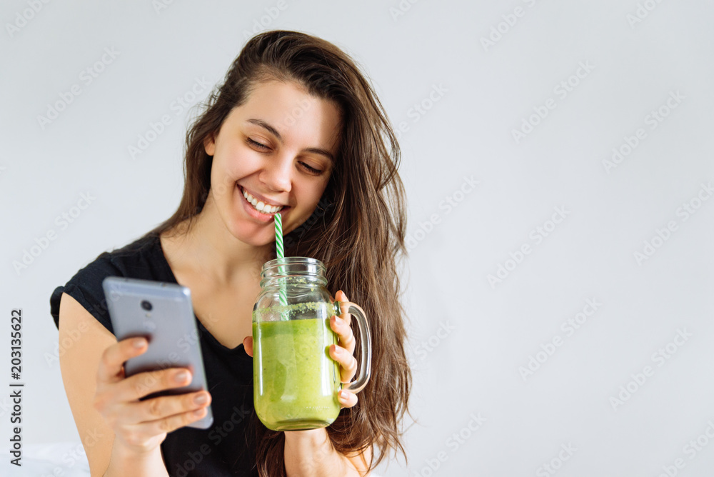 young pretty woman portrait drink smoothie. white background. copy space young pretty woman portrait drink smoothie. white background. copy space