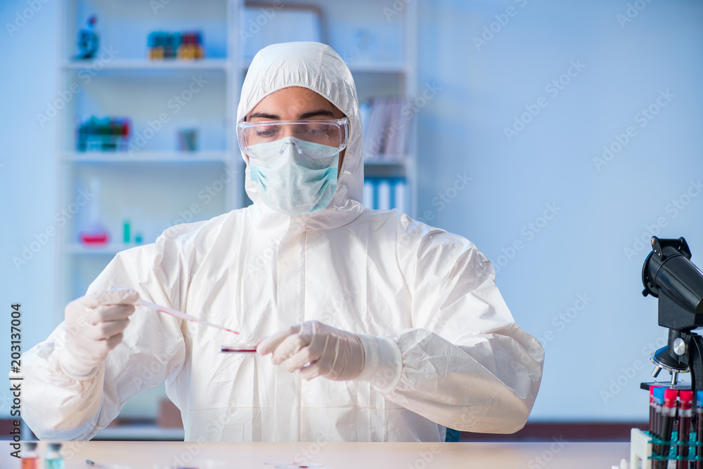 Lab assistant testing blood samples in hospital Lab assistant testing blood samples in hospital
