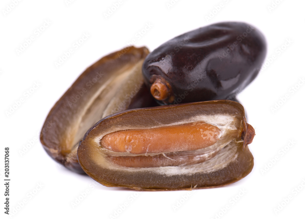 Dates fruit isolated on white background. Dates with a half. Close-up Dates fruit isolated on white background. Dates with a half. Close-up