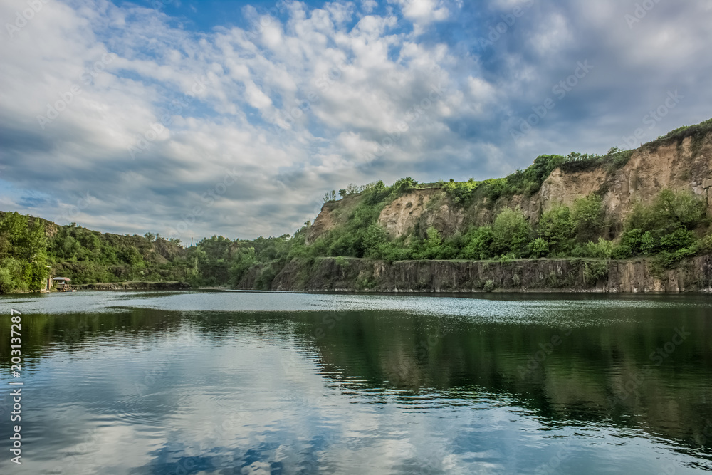 quarry nature mountain landscape with lake on foreground and hill on background