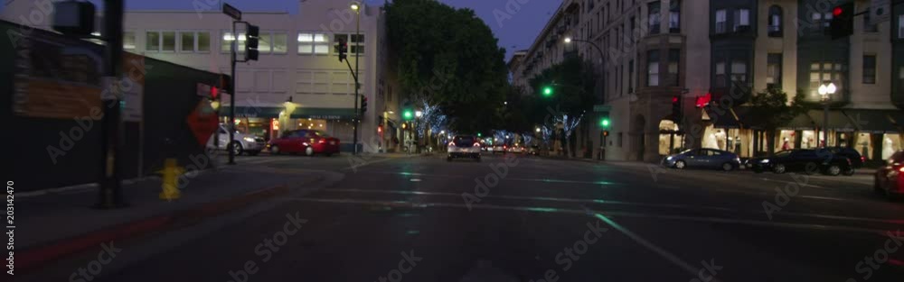 Front view of a Driving Plate: Car travels on Green Street in downtown Pasadena, California, at twilight. It turns left onto Fair Oaks Avenue, left onto West Union Street, left onto DeLacey Avenue, and right onto Colorado Boulevard, continuing to Pasadena Avenue. Front view of a Driving Plate: Car travels on Green Street in downtown Pasadena, California, at twilight. It turns left onto Fair Oaks Avenue, left onto West Union Street, left onto DeLacey Avenue, and right onto Colorado Boulevard, continuing to Pasadena Avenue.