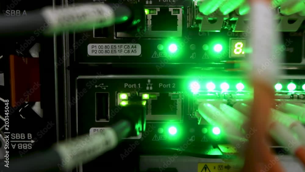 Rack Mounted Servers. Optical server. Commutator. flashing lights. Optical fiber. Video IP Gateways. Audio. Severs computer large data center. Rack Mounted Servers. Optical server. Commutator. flashing lights. Optical fiber. Video IP Gateways. Audio. Severs computer large data center.