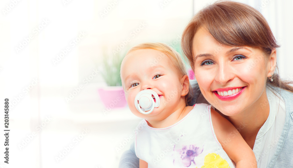Happy family at home. Mother and her little daughter together. Maternity concept. Parenthood Happy family at home. Mother and her little daughter together. Maternity concept. Parenthood