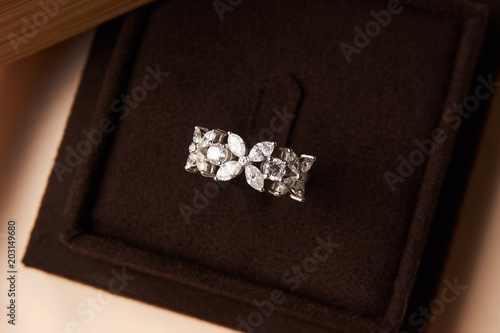 Wedding diamond ring with gift box, close-up. Luxury female jewellery, selective focus © Gecko Studio