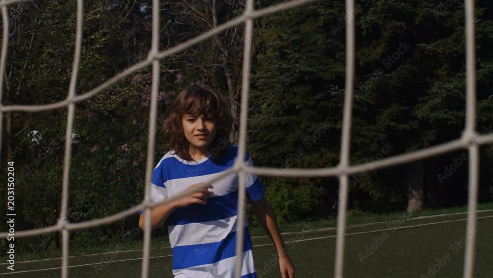 Slow motion of young boy heading football soccer scoring goal, 4k Slow motion of young boy heading football soccer scoring goal, 4k