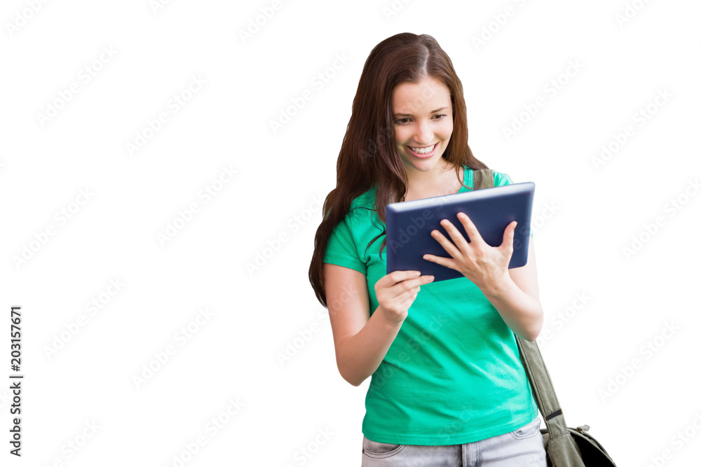 Student using her tablet in library against white background with vignette Student using her tablet in library against white background with vignette