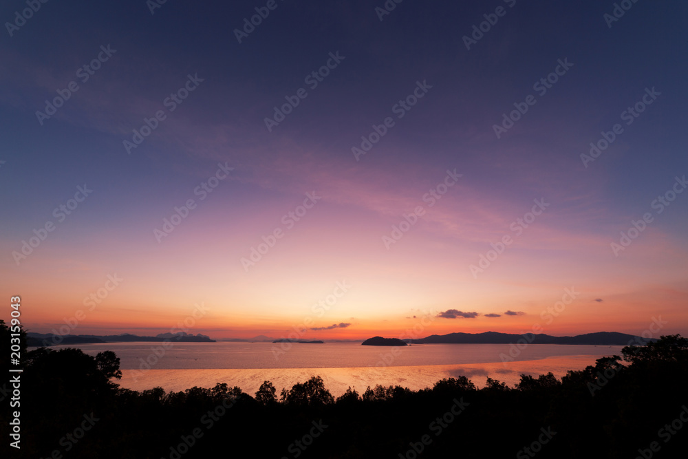 Beautiful scenery nature of light sunrise or sunset over tropical sea in phuket thailand.