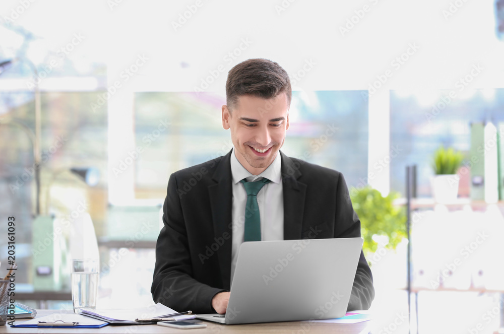 Consultant working at table in office Consultant working at table in office