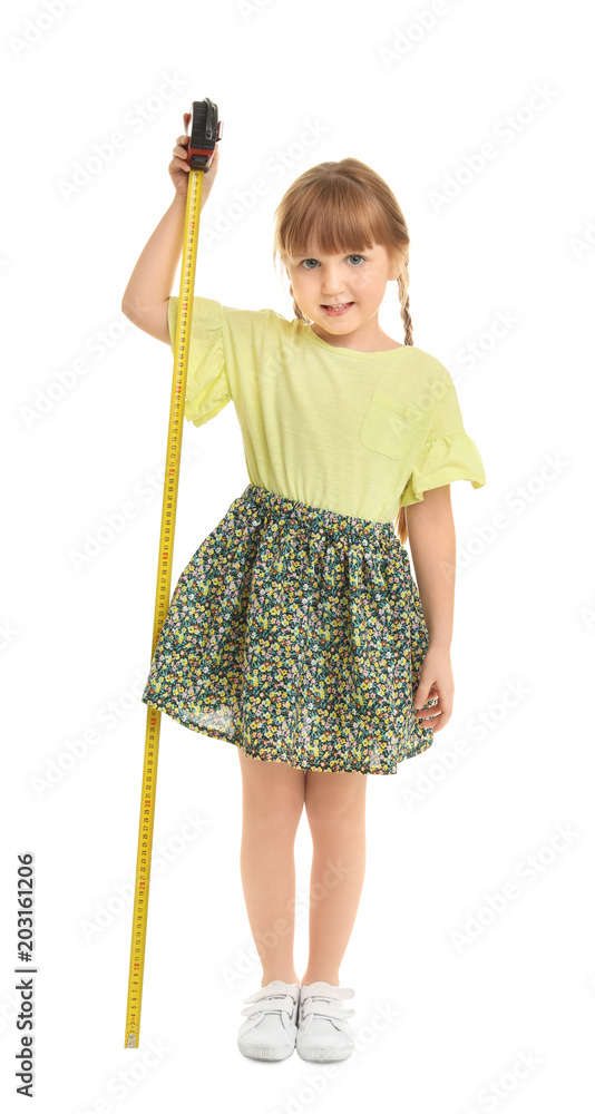 Little girl measuring her height on white background Little girl measuring her height on white background