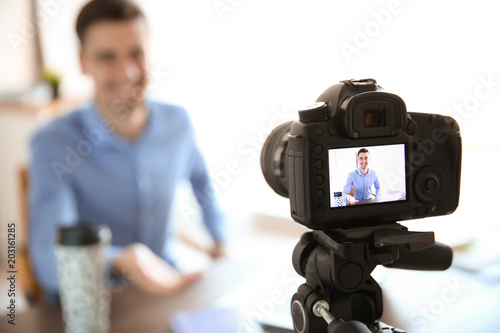 Male blogger on camera screen, closeup