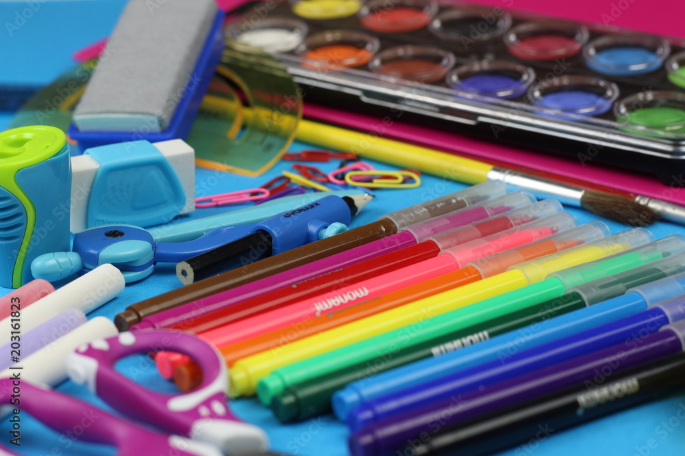School supplies on a blue background School supplies on a blue background
