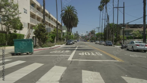 Rear view of a Driving Plate: Car traveling on Bicknell Avenue turns onto Ocean Avenue and transitions onto Barnard Way, continuing to Neilson Way in Santa Monica, California. photo