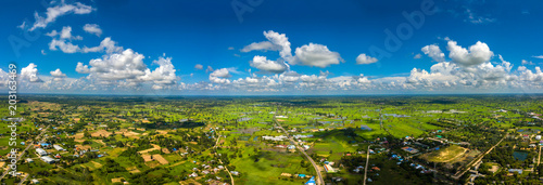 Panorama Top view Aerial photo from flying drone over village in Thailand.Top view beautiful Sunset.Sunrise with cloud over rice field.