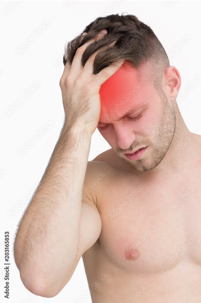Closeup of man suffering from headache with over white background Closeup of man suffering from headache with over white background