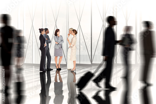 Composite image of business colleagues talking against white room with large window overlooking city