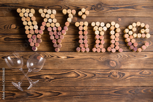 Wine lettering made of corks with two glasses